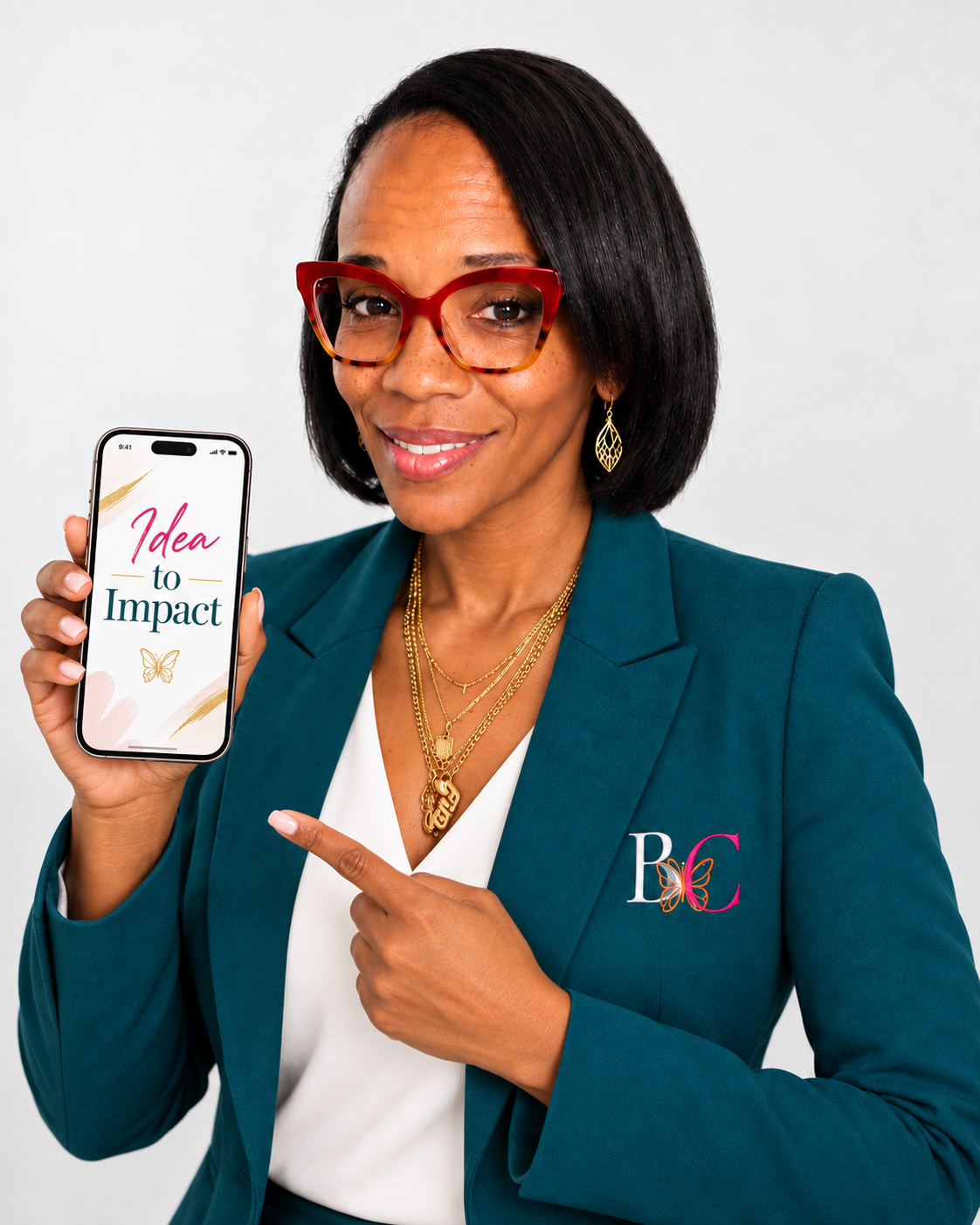 Talia holding a phone that reads Ideas to Impact